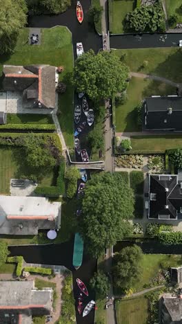 aerial view of a dutch canal village with boats