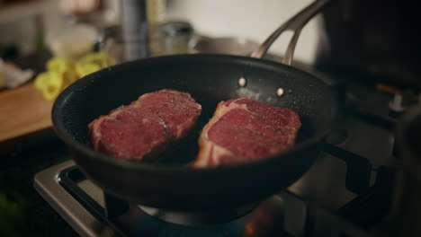 cooking steak in a pan