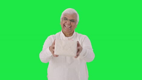 Happy-Indian-old-man-giving-a-gift-Green-screen