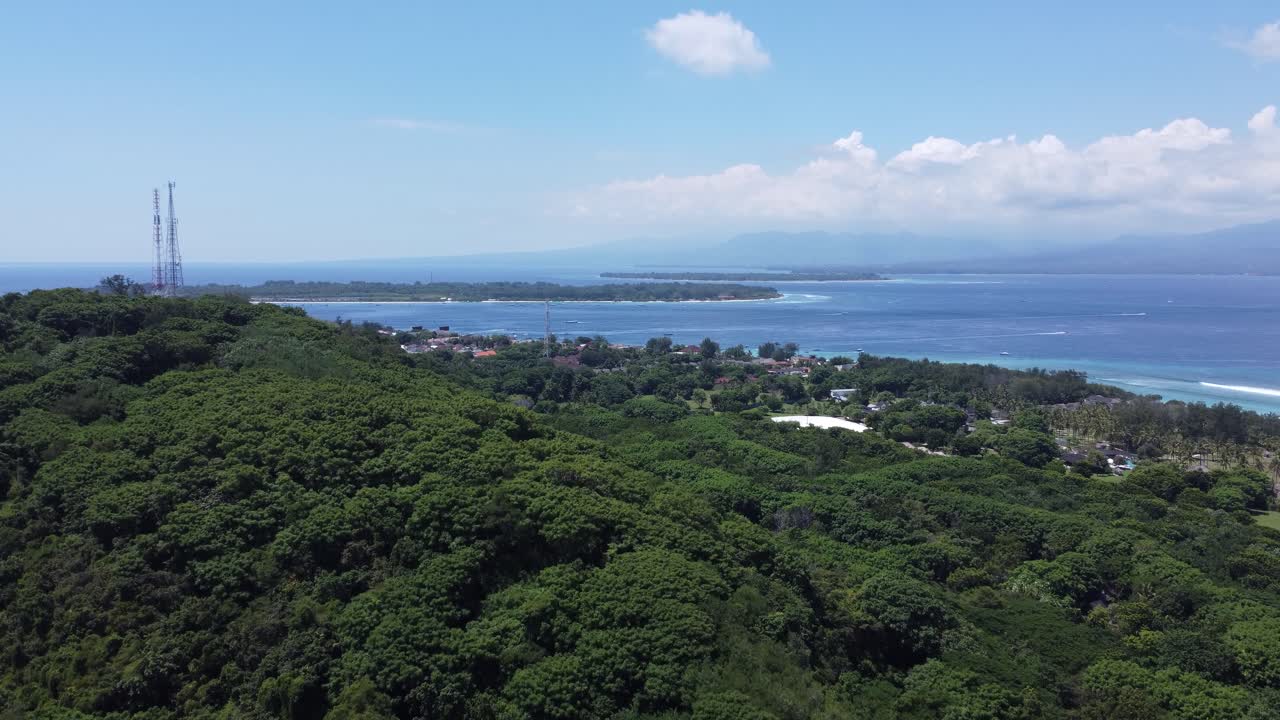 Aerial View of Tropical Island Coastline with Village and Ocean