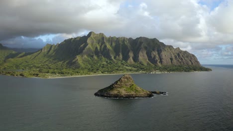 Full aerial view of Chinaman&#039;s Hat with the Kualoa Ranch mountains in the background