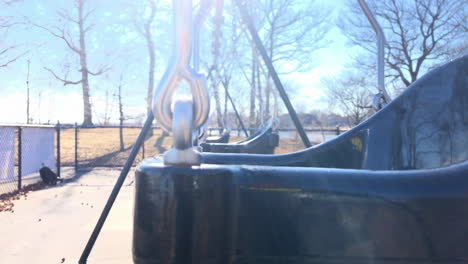 empty toddler swing set in park, winter time