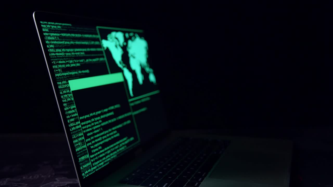 Hacker Concept. Code On A Laptop Computer Monitor In A Dark Room