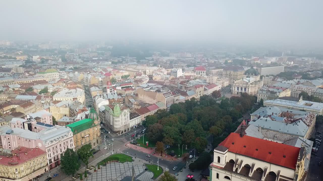 Aerial view of city central part of Lviv with historical buildings and trees. Beautiful cityscape of the european city at day.