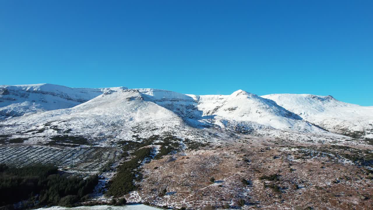 Ireland Mountains drone rising revealing snowy Comeragh Mountains Waterford on a stunning winter day
