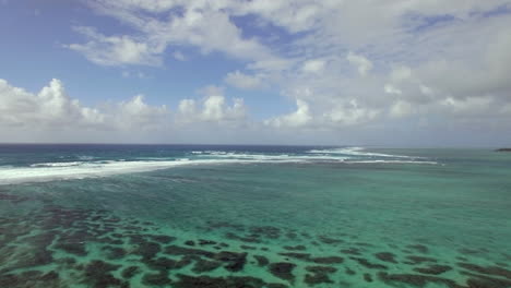 flying over indian ocean by coast of mauritius island