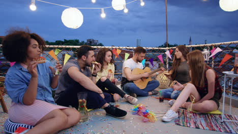 rooftop party friends enjoying evening