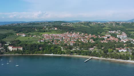 aerial: ankaran town in slovenia on mediterranean coast, summer day