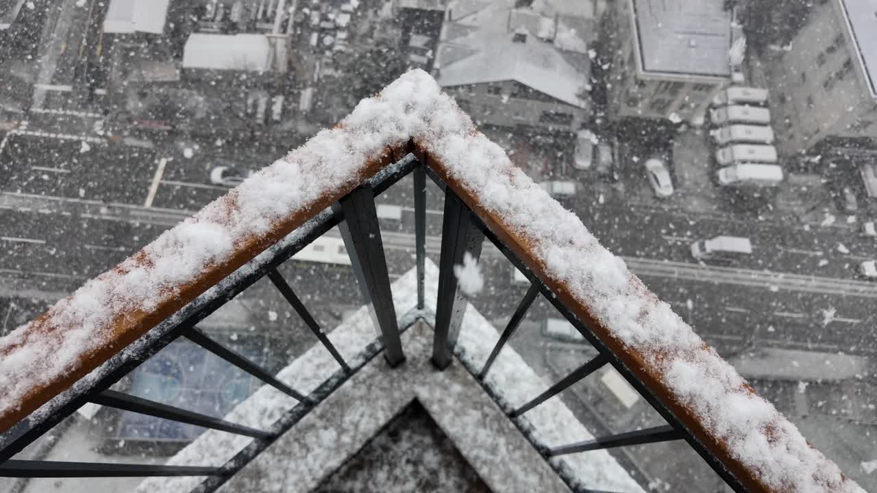 Snowy Balcony View in the City