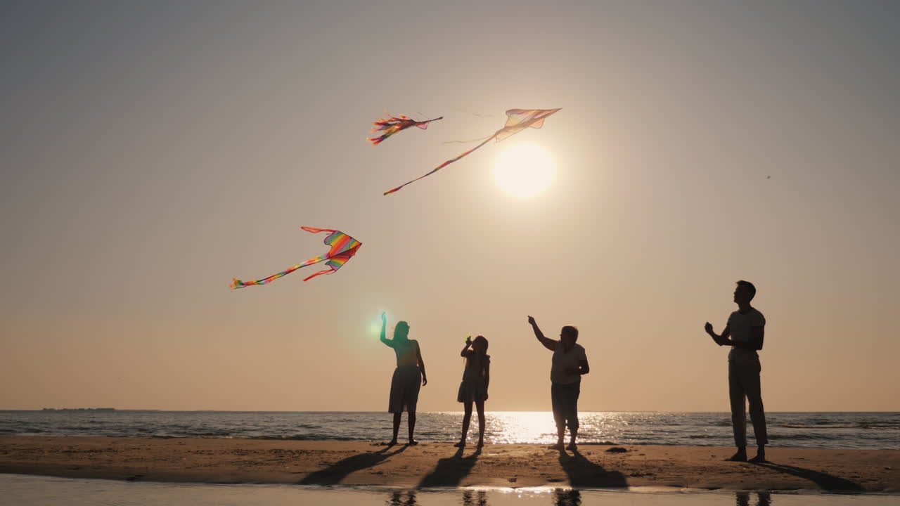 한 젊은 가족이 적극적으로 함께 시간을 보냅니다 - 그들은 연을 연주합니다
