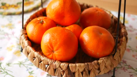 mandarin oranges in a wicker basket
