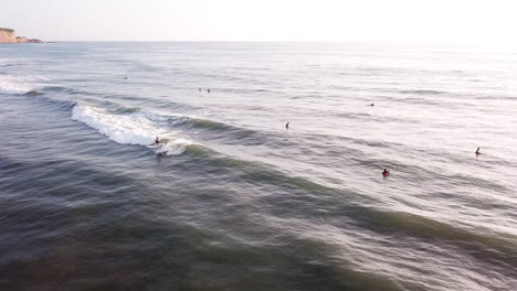 Surfing-At-Olon-Beach,-Ecuador---Tourists-Having-Fun-On-Riding-Ocean-Waves