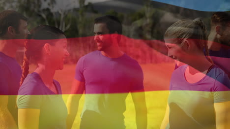 animación de la bandera de alemania ondeando sobre amigos caucásicos en el parque