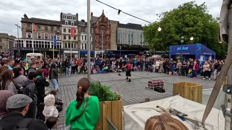 crowd watching a street performer in edinburgh