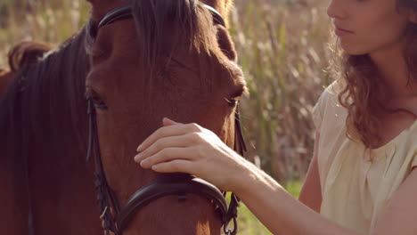 pretty woman petting a horse