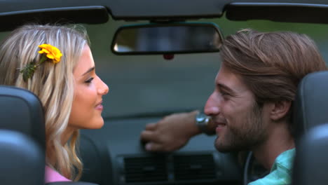 couple kissing in the car