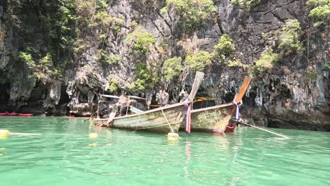 people working together to upright a capsized boat