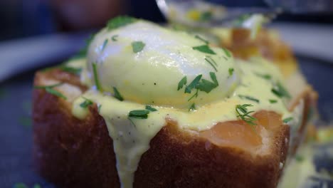 close up of a plate of eggs benedict with smoked salmon