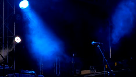 free stage with blue lights before concert