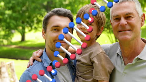 animation of dna strand over happy caucasian grandfather, father and son embracing in park