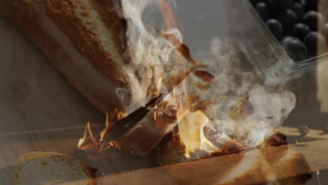 in kitchen, flames and smoke rising over bread and blueberries, creating animation
