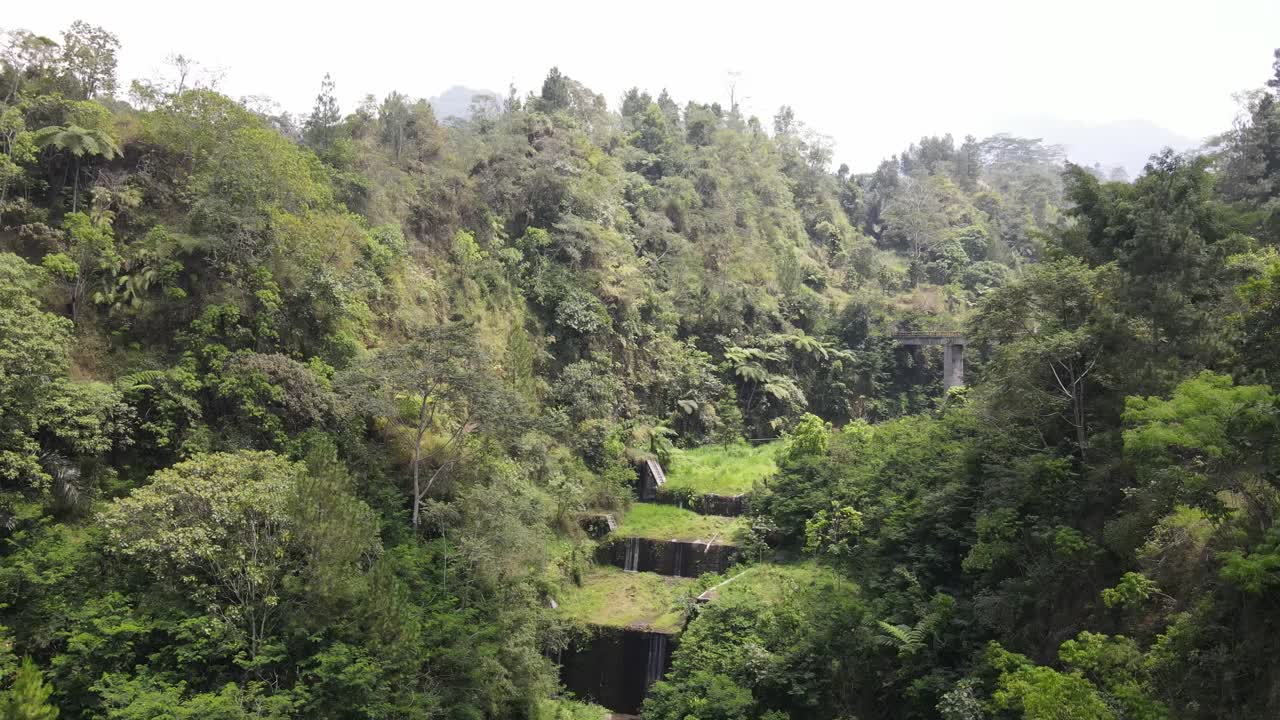 Aerial view of the natural tourist attraction of the beautiful and historic Plunyon Kalikuning bridge. Built for irrigation around 1982-1983