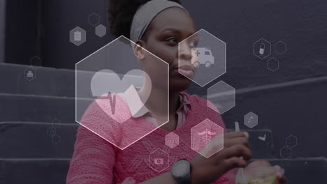 animation of digital icons data processing over african american woman