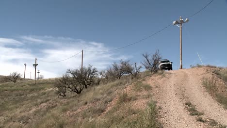 a vehicle sits on a path in a remote area