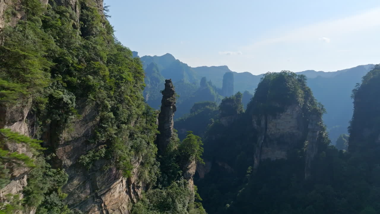Aerial view flying close to karst pillars of Huangshi village, Zhangjiajie, China