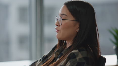 Emotional-woman-talking-at-windows-office-portrait.-Gesturing-woman-explaining