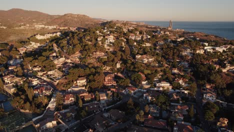 Drone-shot,beautiful-sun-light,forward-moving,sunrise,goldenhour,Spain,Andalusia,Malaga,Malaga-city,Puerto-Deportivo-el-Candado,hills,morning,El-Candado