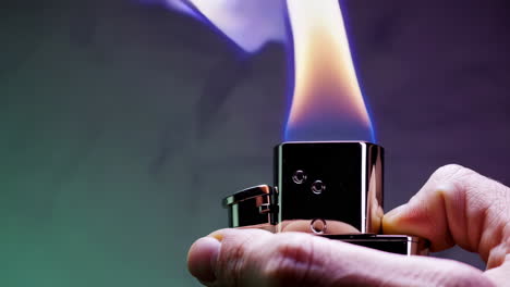 handheld lighter with burning flame