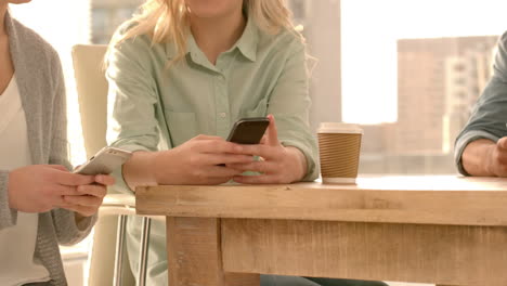 work colleagues using their smartphones