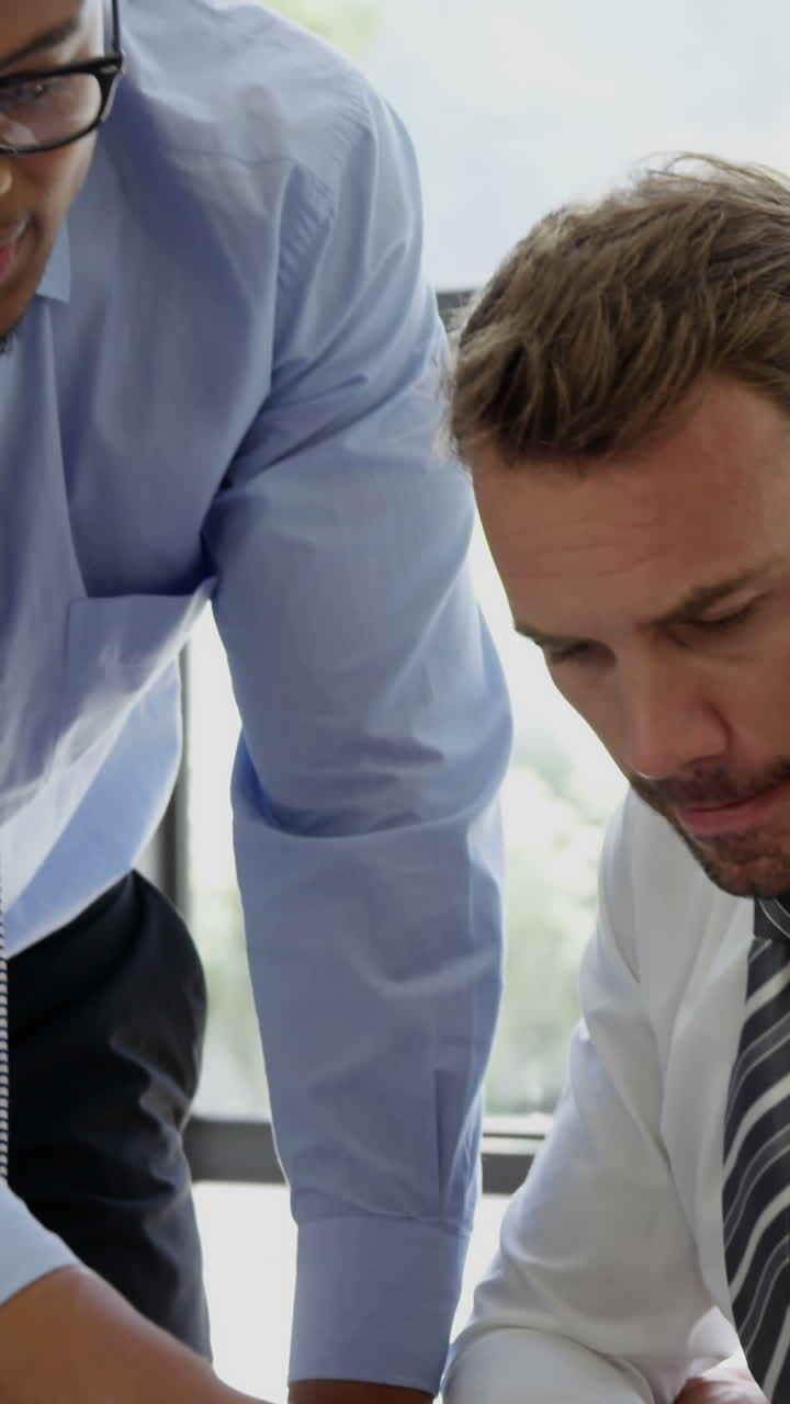 Businesspeople working together around a table