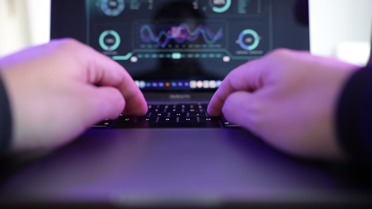 Cinematic macro shot of hands actively typing on a laptop keyboard, representing online work, content creation, programming, communication, and office productivity.