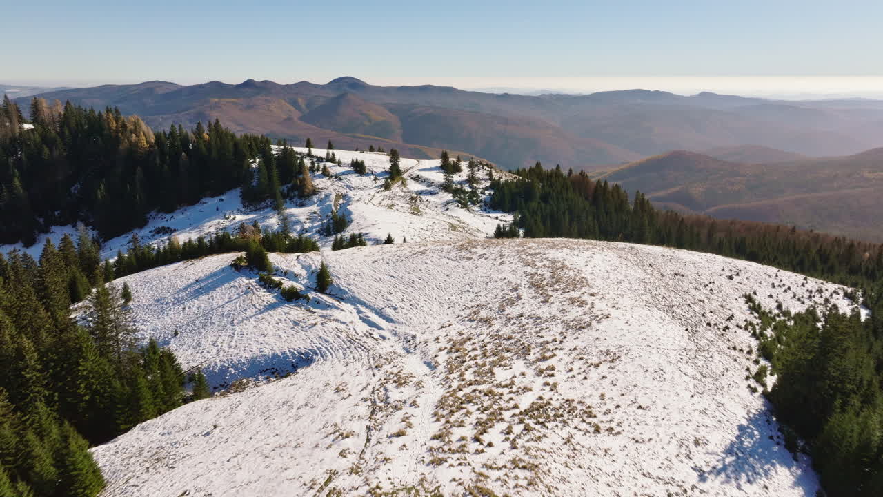 Aerial drone view of a little snow on the Bucegi Mountains, near Brasov, Romania
