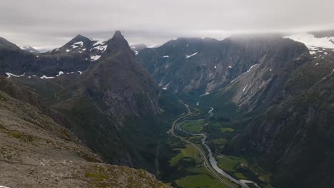 a fabulous view from the top of the mountain on a cloudy day along the way on the famous hike of romsdalseggen in norway near ålesund