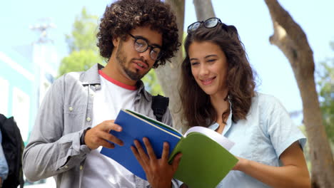 friends interacting while reading books