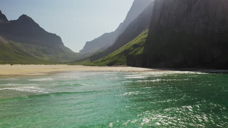 cinematic drone shot at horseid beach flying over turquoise blue water