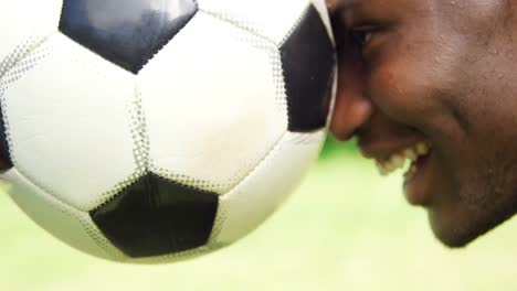 man holding a ball with his son