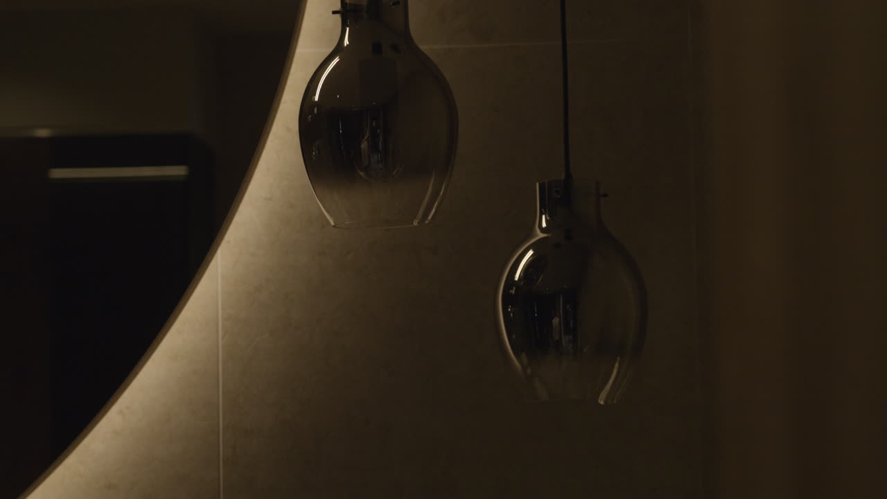 Modern retro lamps being turned on and off in a dark room in 4K