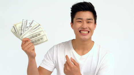 happy asian man holding bills