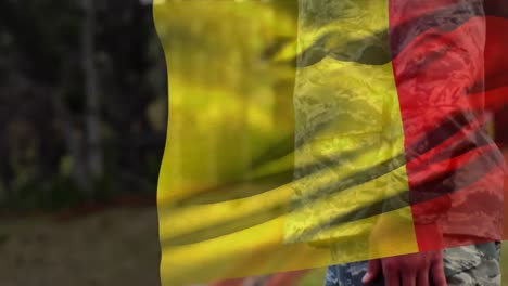 animation of flag of belgium over caucasian male soldier