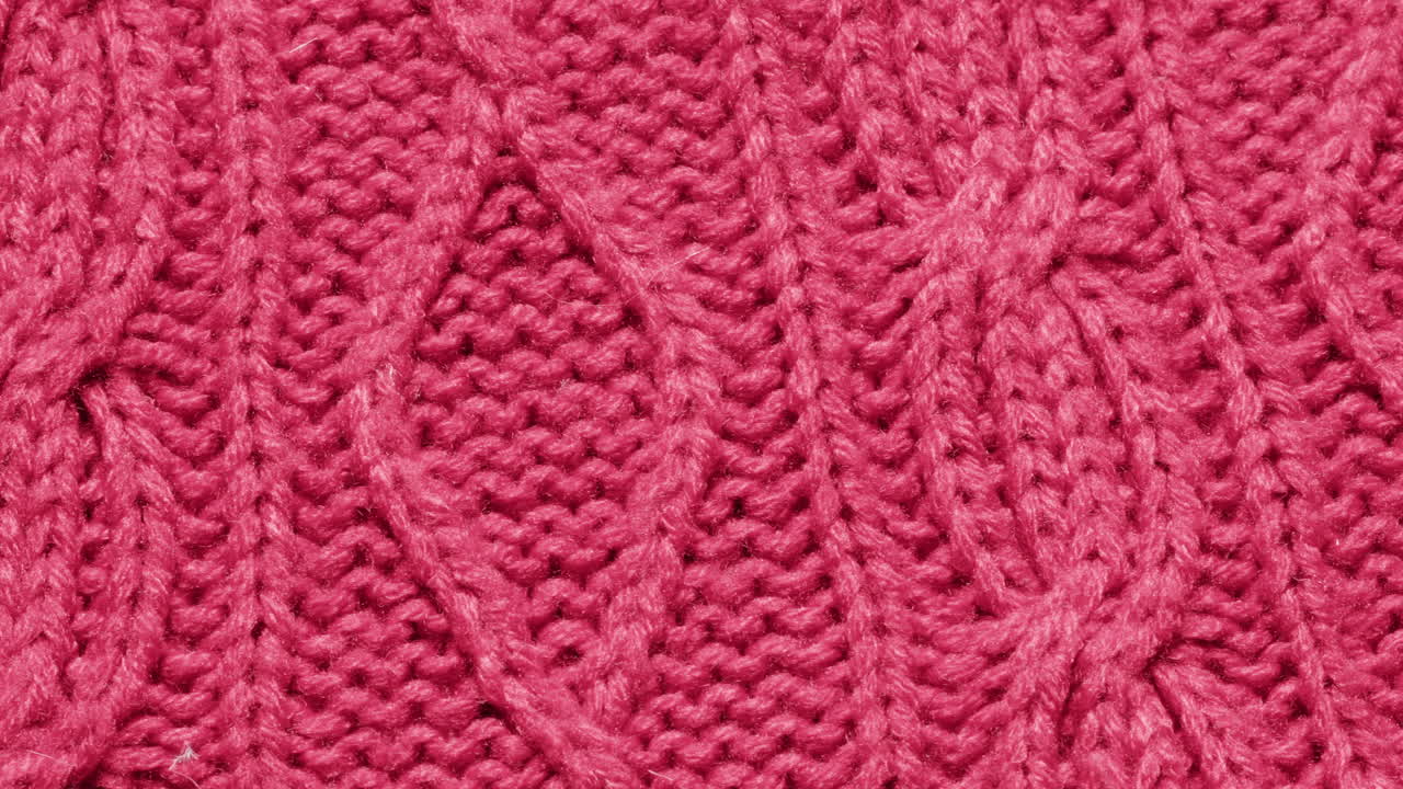 Close-up of a deep pink knitted fabric