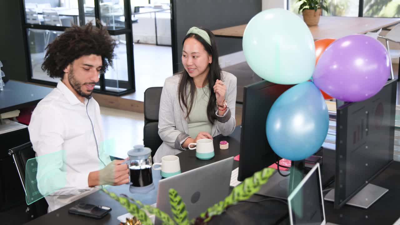 Man reaching for French press, pouring coffee while woman watching, celebrating office party