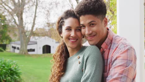 video of smiling biracial couple spending time in the garden