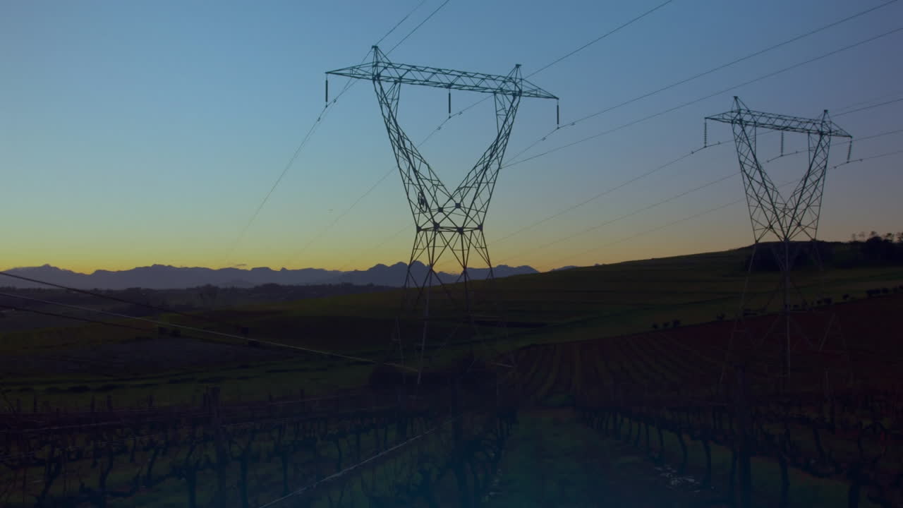 Animation of glowing globe over electricity pylons