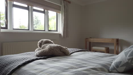 left to right pan of a modern looking bedroom in a countryside home