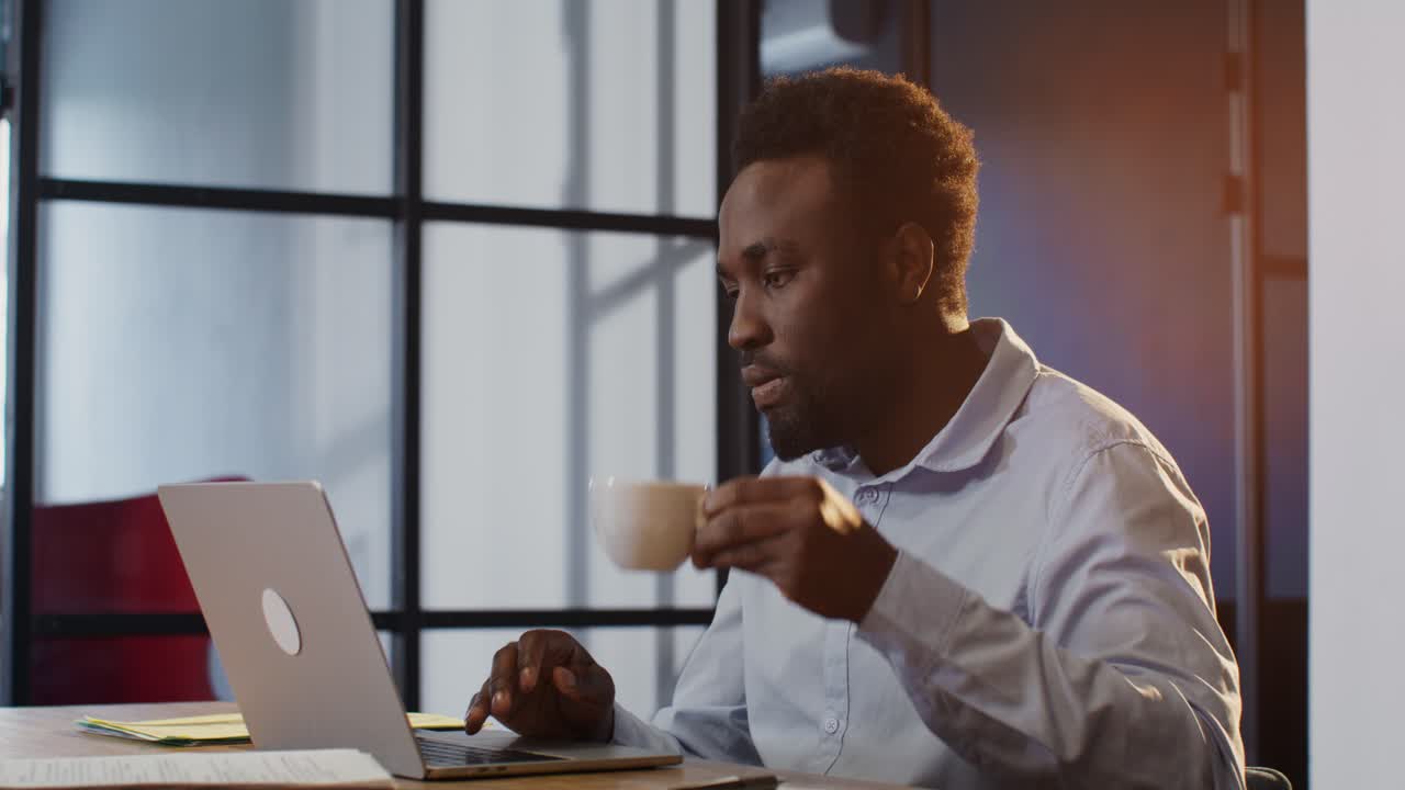 Businessman working on laptop in office