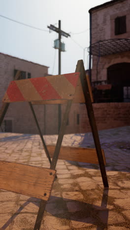 wooden barricade on a cobblestone street in an old town